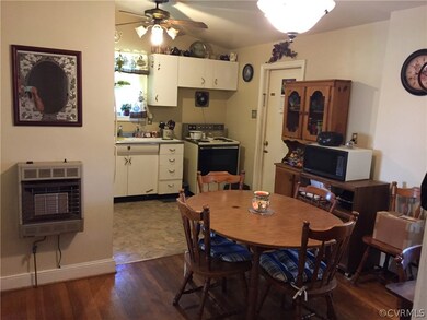 Eat-in kitchen with large dining area. Hardwood and vinyl flr, ceiling fan, vaulted ceiling.