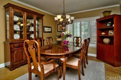 FORMAL DINING ROOM WITH CROWN MOLDING AND PLANTATI