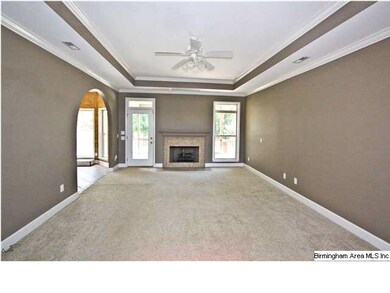 Living room opens up to back deck.