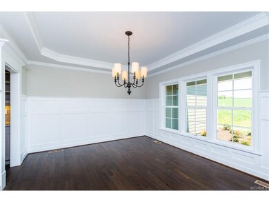 Full sized dining room with triple window overlook