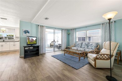 Living room with a wealth of natural light, wood f