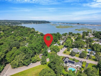 Aerial overview of property's location with a nearby body of water