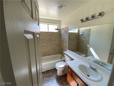 Bathroom featuring toilet, tub / shower combinatio