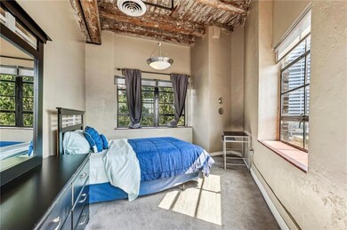Bedroom featuring visible vents, baseboards, multi