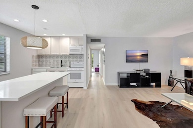 74 Normandy B, Delray Beach, FL 33484 - photo 2