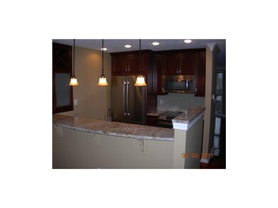 Kitchen. Beautiful dark cabinets, granite counter 