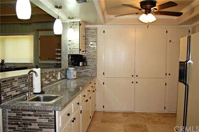 Wet bar in kitchen, looking out towards formal din