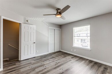 Unfurnished bedroom with wood finished floors, a 