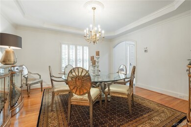 Dining room featuring crown molding, a notable cha