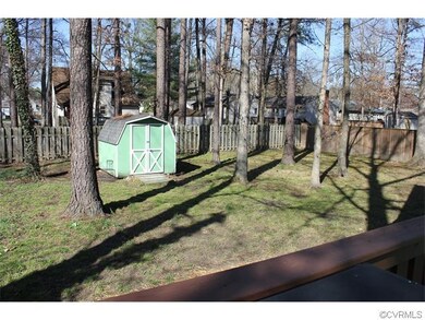 Large, fenced-in yard with storage shed.