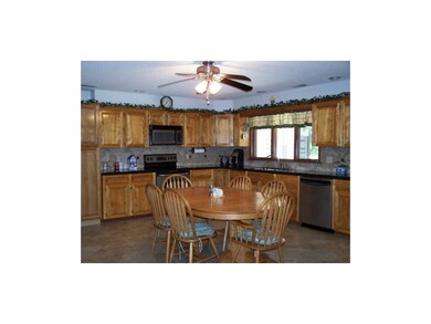 Kitchen with new tile floor and granite counter to