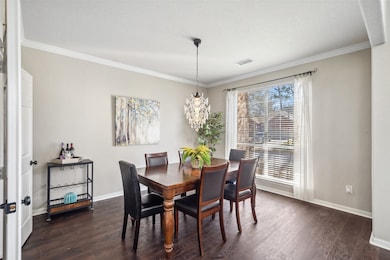 The formal dining room with a gorgeous chandelier!