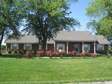 Brick home and circle drive.