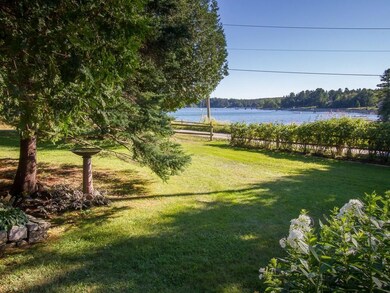 Fence with rosa rugosa on the water side