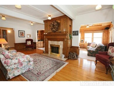 Ornate two sided fireplace in the living room with