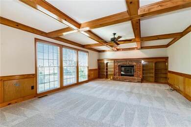Oversized living room with beautiful beams and bui
