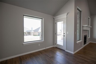 Doorway with dark hardwood / wood-style floors and