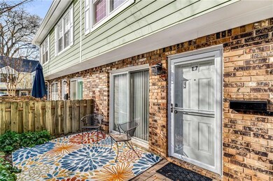 Front entry through walled patio with sliding glass doors and secure front entry