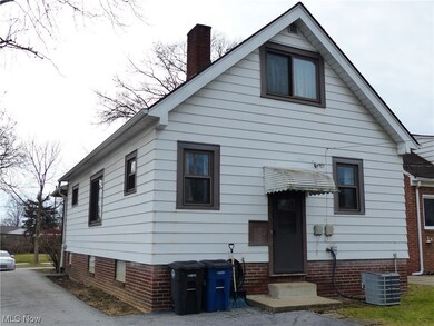 Rear view of house with central air condition unit
