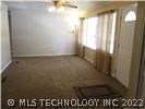 Living Room large windows, ceiling fan, steel entr