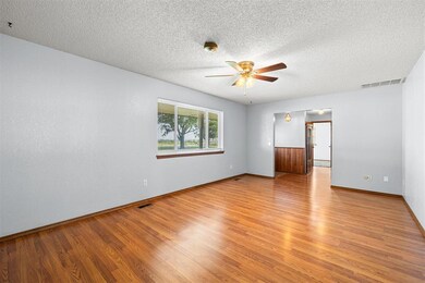 Empty room featuring light wood-type flooring, cei