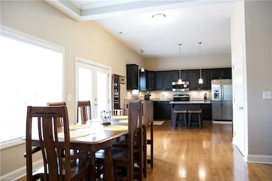 Dining area extends into the beautifully updated kitchen with granite countertops, gorgeous new backsplash and large island.
