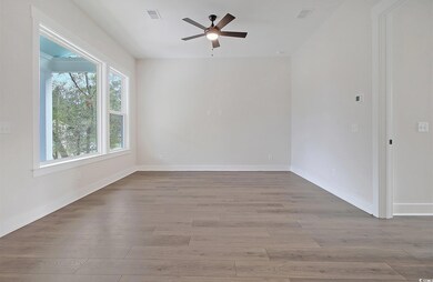 Spare room with light wood-type flooring and ceili