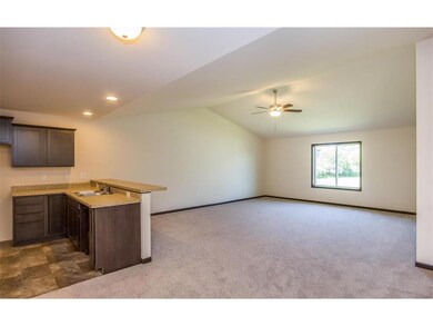 Living Room/Great Room and side view of eat-in Kit