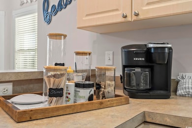 Kitchen view of light brown cabinetry