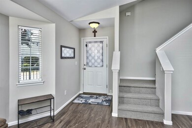 Inviting laminate floor entryway welcomes you insi