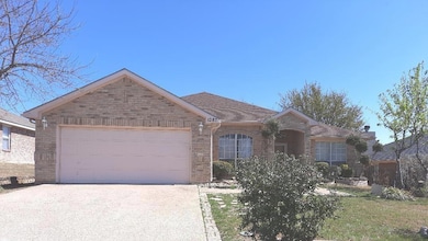 Single story home with driveway, a shingled roof, 