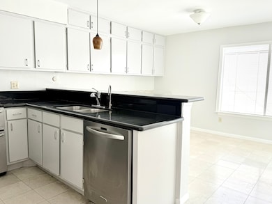 Spacious kitchen with breakfast bar and area
