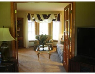 Living Room. FRENCH DOORS SEPARATE THE FAMILY ROOM