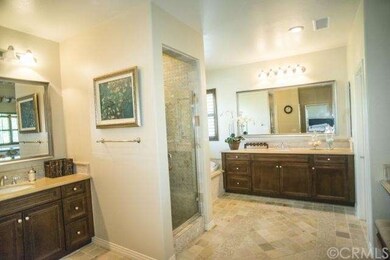Master bathroom with dual sinks, shower and tub.