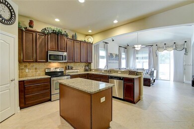 The large kitchen features a walk-in pantry, a cen