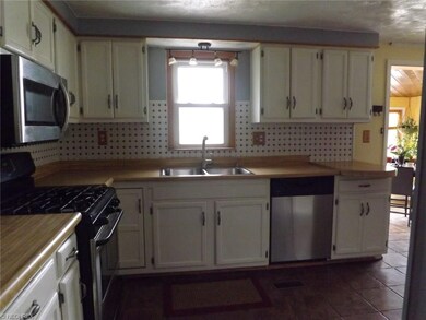 Kitchen with all stainless steel appliances stayin
