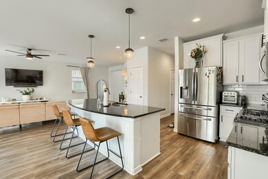 Kitchen with stainless steel appliances, a sink, 