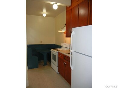 Kitchen showing a great eat-in area with a booth.