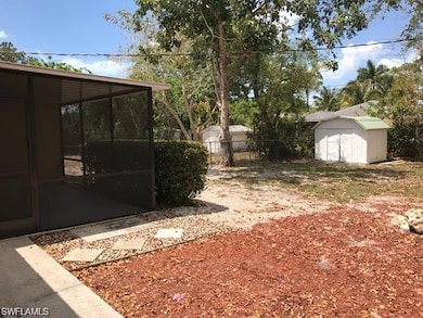 View of yard with a sunroom