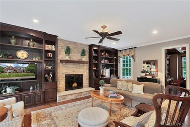 Family room with stone gas fireplace with built-in