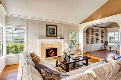 Living room with vaulted ceilings, cozy fireplace,