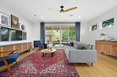 Living area with a ceiling fan, recessed lighting