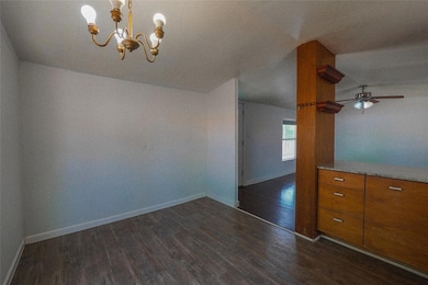 Unfurnished dining area featuring dark wood-style
