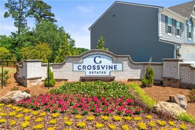 Community sign featuring fence