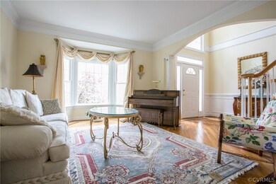 Living room w/ large walk-out Bay window open to t