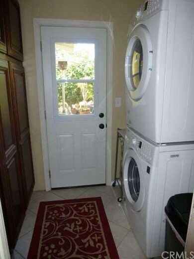 Separate laundry room. New door, retractable screen door, additional storage.