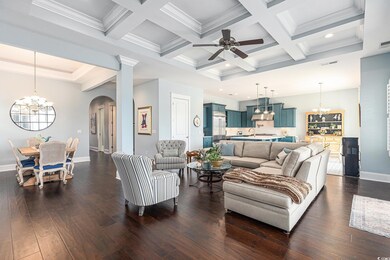 Living area featuring a chandelier, arched walkway