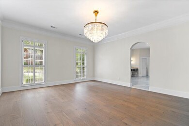 Spare room featuring crown molding, a notable chan