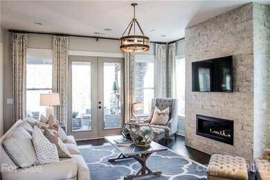 LIGHT FILLED GATHERING ROOM WITH LINEAR GAS LOG FI