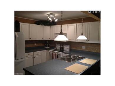 Updated kitchen with new cabinets, tile backsplash